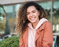Smiling woman sitting outside