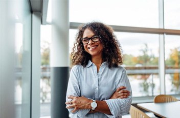 a woman smiling as a denture candidate