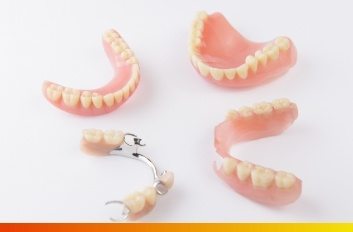Two partial dentures and two full dentures