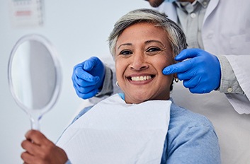 Woman smiling in a dental chair