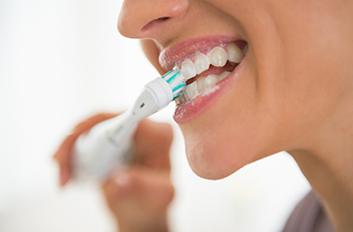 Woman brushing her teeth