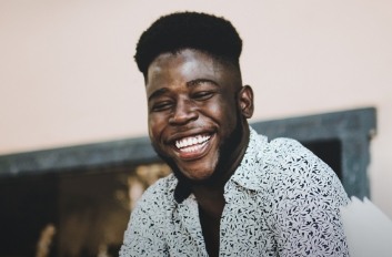 Laughing man in short sleeve button up shirt