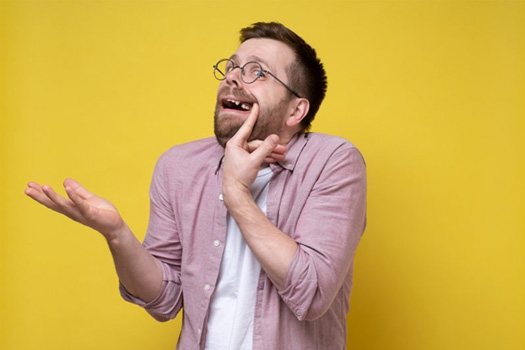 Man pulling his lip back to reveal a missing tooth