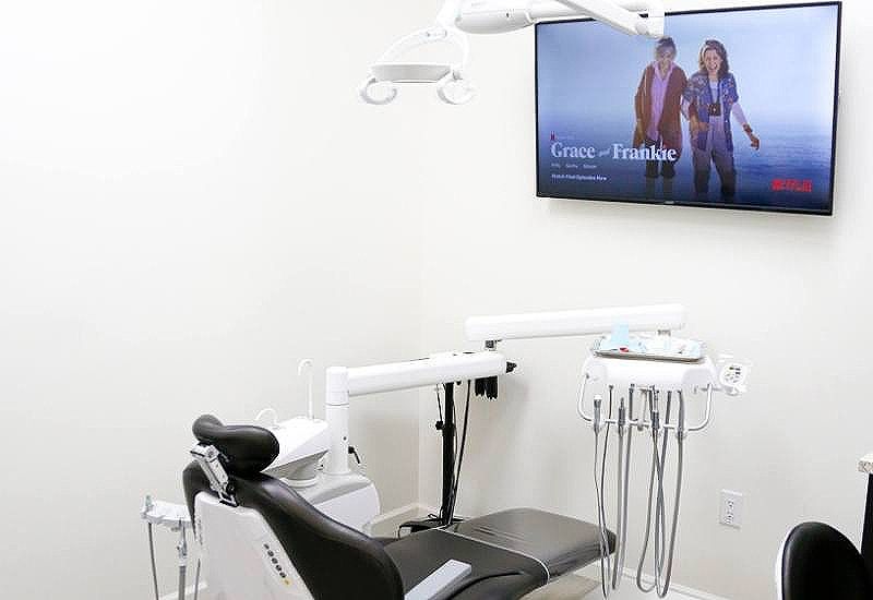 Netflix on television screen in dental treatment room