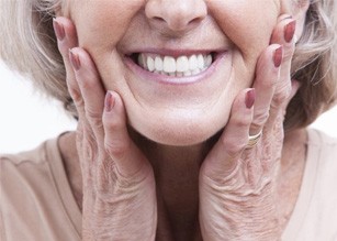 a dental implants patient smiling